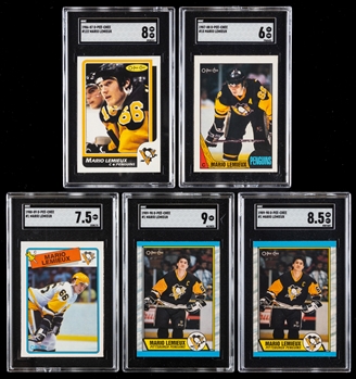 1986-87 to 1989-90 O-Pee-Chee and Topps SGC-Graded Hockey Cards of HOFer Mario Lemieux (9) Inc. 1986-87 OPC #122 (SGC 8) and 1987-88 Topps #15 (SGC 9)
