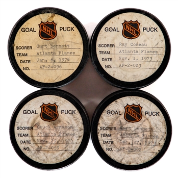 Curt Bennett (2), Ray Comeau and Chuck Arnason Atlanta Flames 1973-74 Goal Pucks from the NHL Goal Puck Program (Barry Meisel Collection)