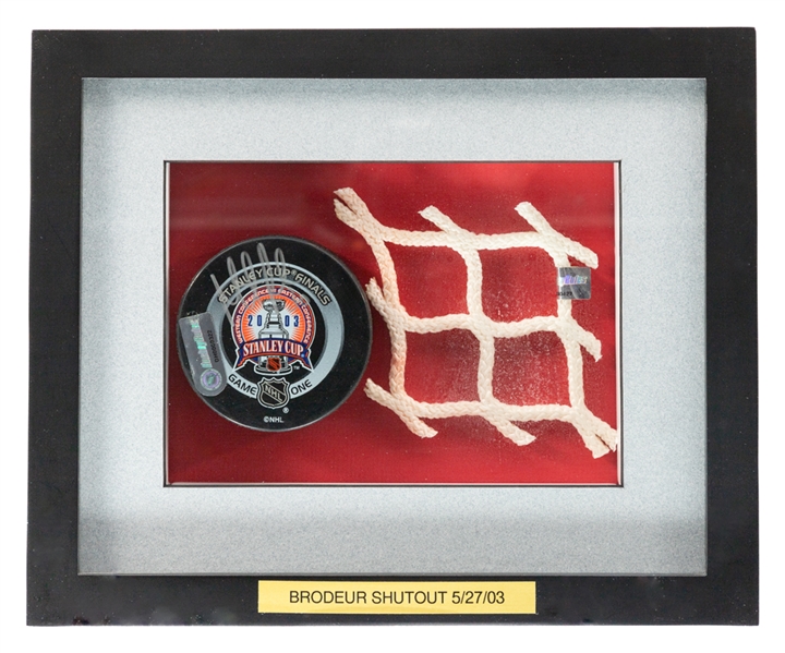 Martin Brodeurs May 27th 2003 Stanley Cup Finals Game #1 Signed 1st Period Game-Used Puck from Shutout Game and 2003 SC Finals Piece of Net Framed Display with NHL GamePucks Program and Steiner COAs