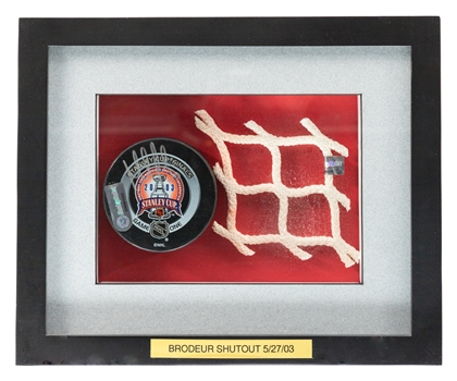 Martin Brodeurs May 27th 2003 Stanley Cup Finals Game #1 Signed 1st Period Game-Used Puck from Shutout Game and 2003 SC Finals Piece of Net Framed Display with NHL GamePucks Program and Steiner COAs