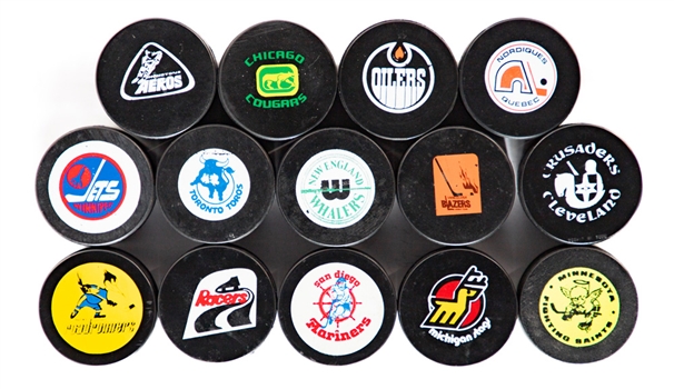 1972-78 WHA Hockey Pucks (14) Including Biltrite (10) and Czechoslovakia Gold "Official Hockey Puck" Reverses (4)