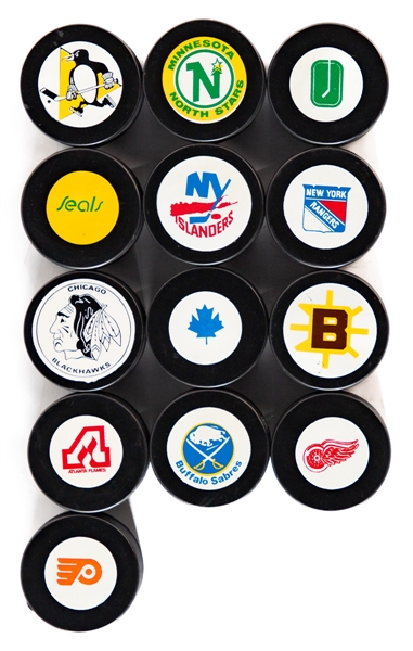 1974-76 NHL Hockey Pucks (18) Including Czechoslovakia Gold "Official Hockey Puck" Reverses (13) and 1970s Czechoslovakia Blank Reverses (5)