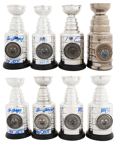 Edmonton Oilers Signed 1984, 1985, 1987, 1988 and 1990 Mini Stanley Cup Collection of 8 with Wayne Gretzky, Paul Coffey, Glenn Anderson and Kevin Lowe - COAs 