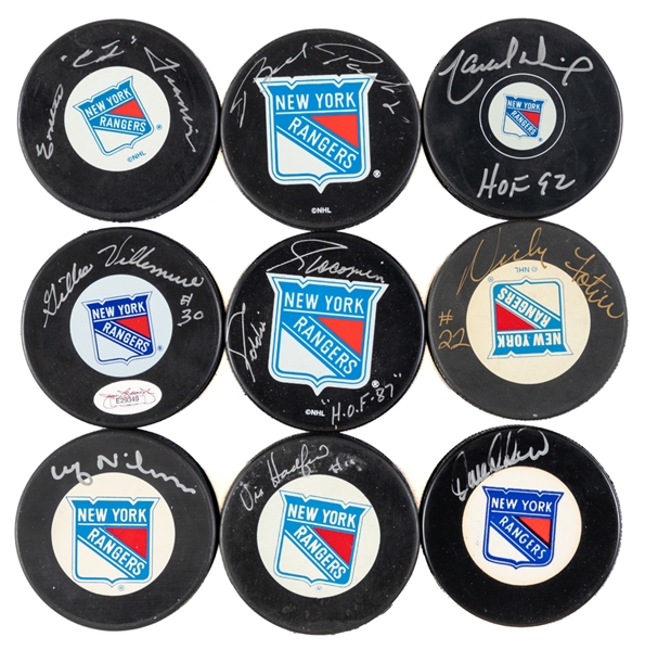 New York Rangers Signed Pucks (9) including 4 HOFers with Dionne, Giacomin, Park and Emile "The Cat" Francis 