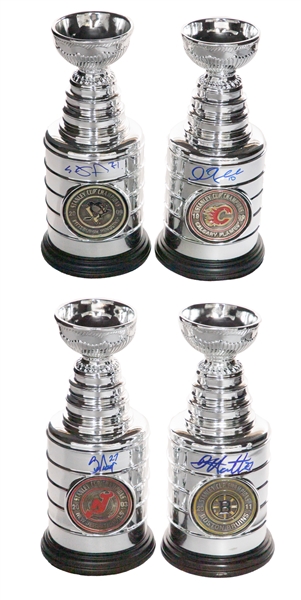 Mini Stanley Cup Signed Collection of 4 with Scott Niedermayer, Evgeni Malkin, Dougie Hamilton and Lanny McDonald 