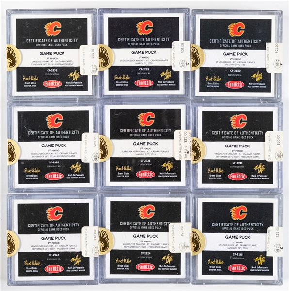 Calgary Flames 2018-19 and 2019-20 Game-Used Puck Collection of 26 - All With COAs!