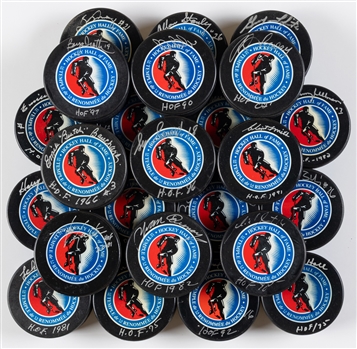 Hockey Hall of Fame Signed Puck Collection of 24 Including Deceased HOFers Hull, Salming, Bouchard, Howell, Pilote, Pronovost, Francis, Stanley, Smith and Moore with LOA