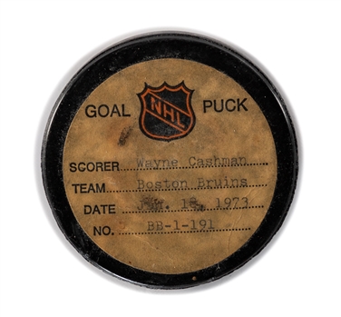 Wayne Cashmans Boston Bruins January 18, 1973 Goal Puck from the NHL Goal Puck Program - Season Goal #14 of 29 / Career Goal #75 of 277