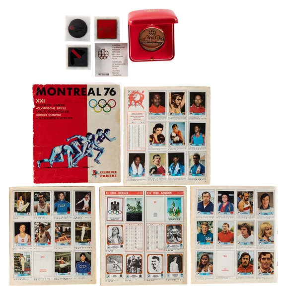 1976 Montreal Olympics Panini Album with Most Stickers Including Cassius Clay, Jessie Owens, Comaneci, Jenner and Spinks Plus 1976 Official Medallion in Box and Paperweights (3)