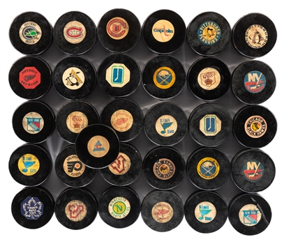 Frank Browns 1968-1977 Art Ross / Converse NHL Game Puck Collection of 31 from His Personal Collection with LOA