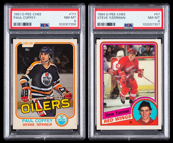 1981-82 O-Pee-Chee Hockey Card #111 HOFer Paul Coffey Rookie (Graded PSA 8) and 1984-85 O-Pee-Chee Hockey Card #67 HOFer Steve Yzerman Rookie (Graded PSA 8)