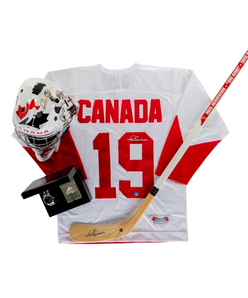 Paul Henderson Signed 2008 World Juniors Team Canada Limited-Edition #2/3 Goalie Mask, Jersey and Stick Plus Ficel 1972 Summit Series Limited-Edition Watch and Card Set with COA For the Mask  